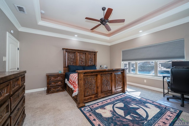 bedroom featuring a raised ceiling, ceiling fan, crown molding, and light carpet