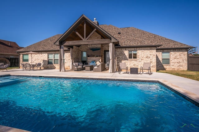 view of pool with central air condition unit, a patio area, and an outdoor living space