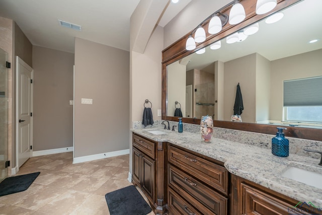 bathroom with vanity, tile patterned floors, and an enclosed shower