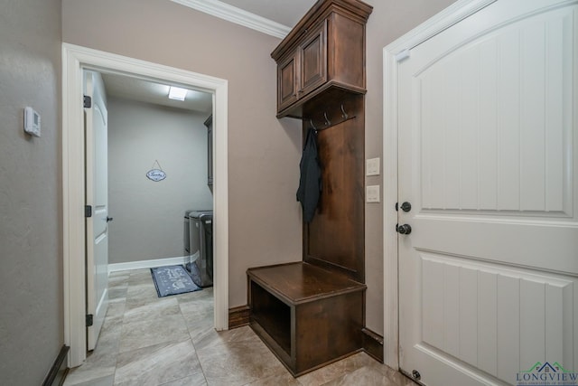 mudroom with washing machine and dryer and ornamental molding