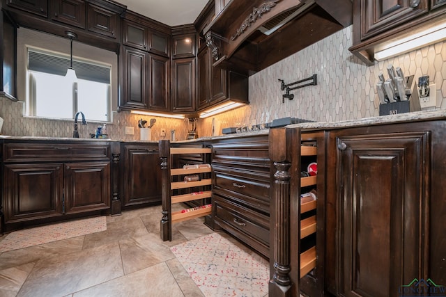 kitchen featuring dark brown cabinetry and custom exhaust hood