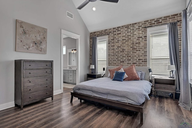 bedroom featuring dark wood finished floors, baseboards, visible vents, and brick wall