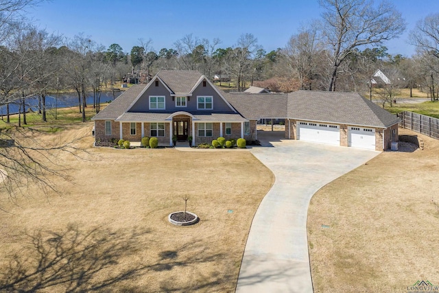 view of front of property with driveway, a front lawn, an attached garage, and fence