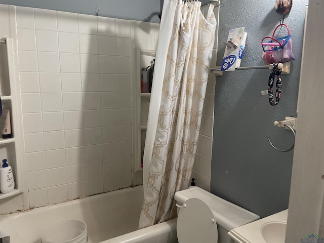 bathroom with shower / bath combo with shower curtain and toilet