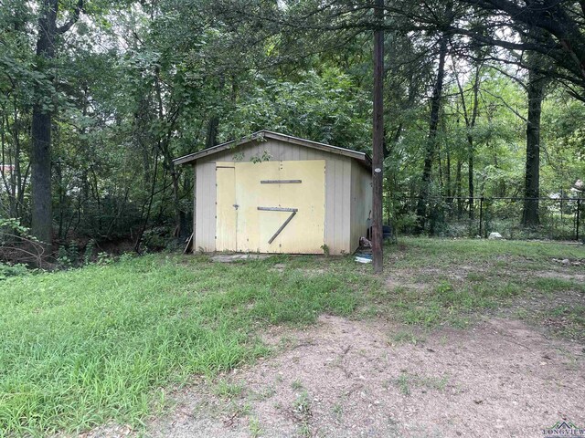 423 S Mobberly, Longview, TX 75602 - view of shed with a view of trees