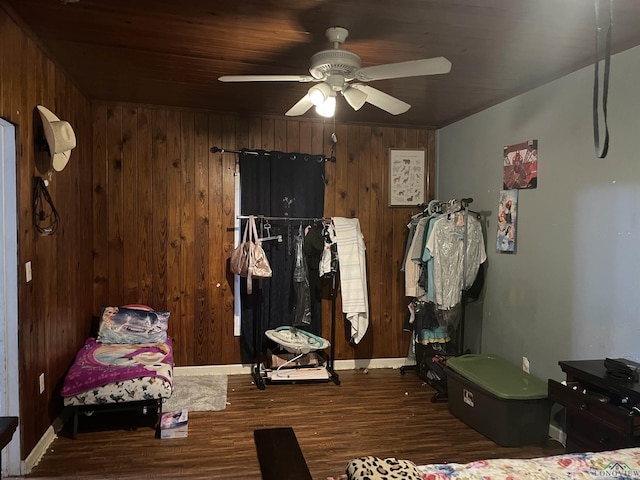 423 S Mobberly, Longview, TX 75602 - bedroom with wood finished floors, wood walls, and ceiling fan