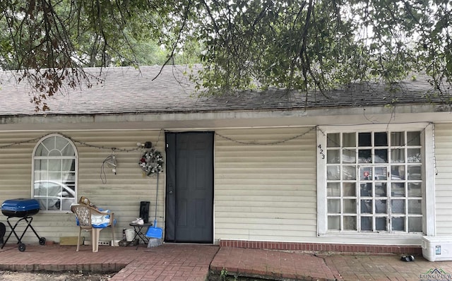 property entrance with a patio area