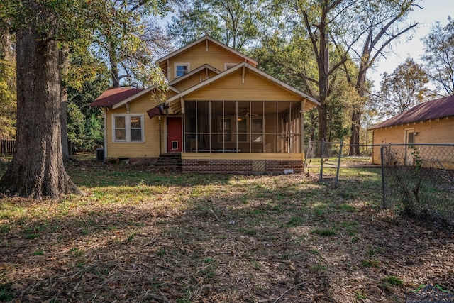 rear view of house with a sunroom