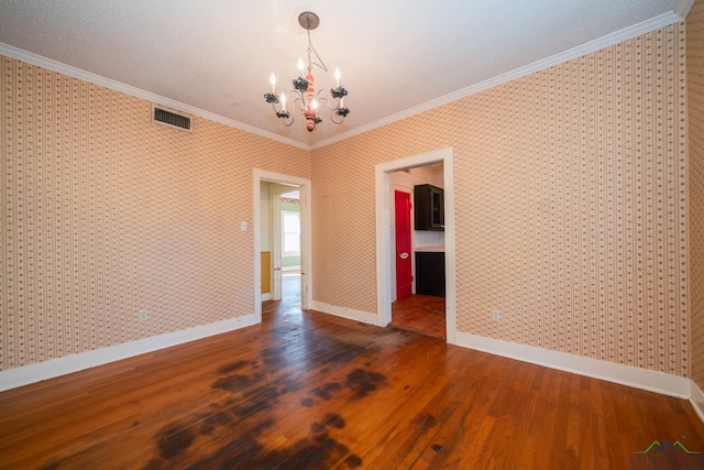 unfurnished dining area featuring a notable chandelier, ornamental molding, and dark wood-type flooring