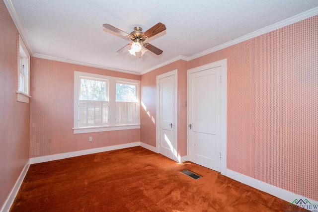 unfurnished bedroom with carpet flooring, ceiling fan, crown molding, and a textured ceiling