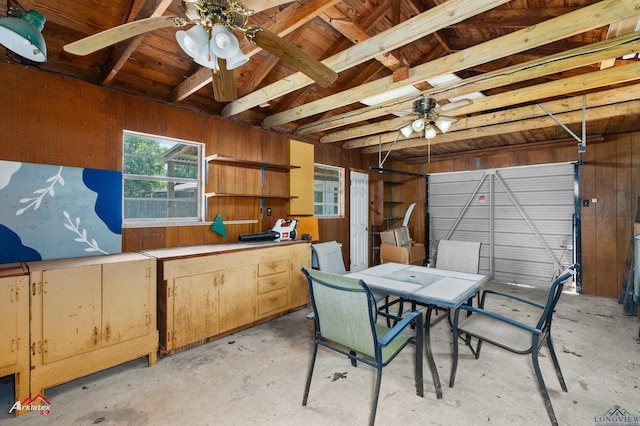 210 Southview Dr, Henderson, TX 75654 - garage with ceiling fan and wood walls