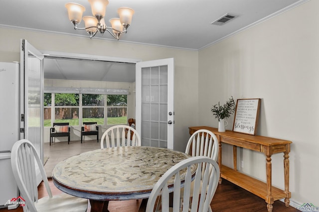 210 Southview Dr, Henderson, TX 75654 - dining area featuring wood finished floors, a chandelier, and ornamental molding