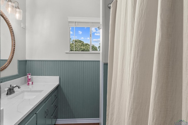 210 Southview Dr, Henderson, TX 75654 - bathroom featuring vanity and a wainscoted wall