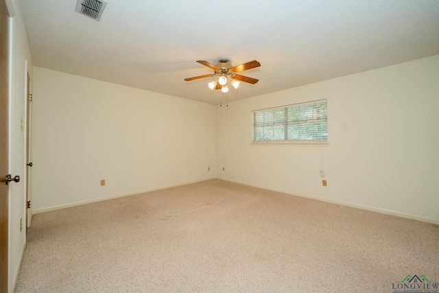 carpeted empty room featuring ceiling fan