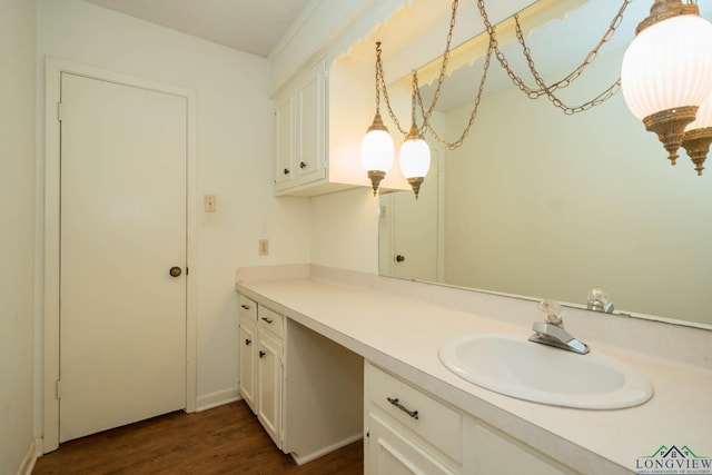 bathroom with hardwood / wood-style floors and vanity