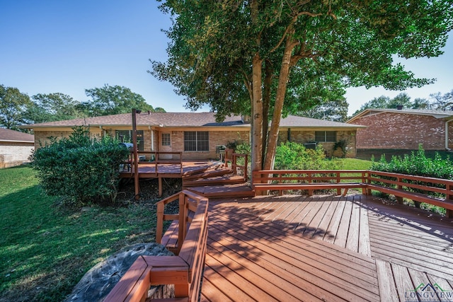 deck featuring a lawn