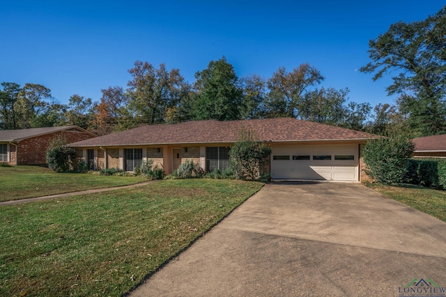 ranch-style house with a garage and a front lawn