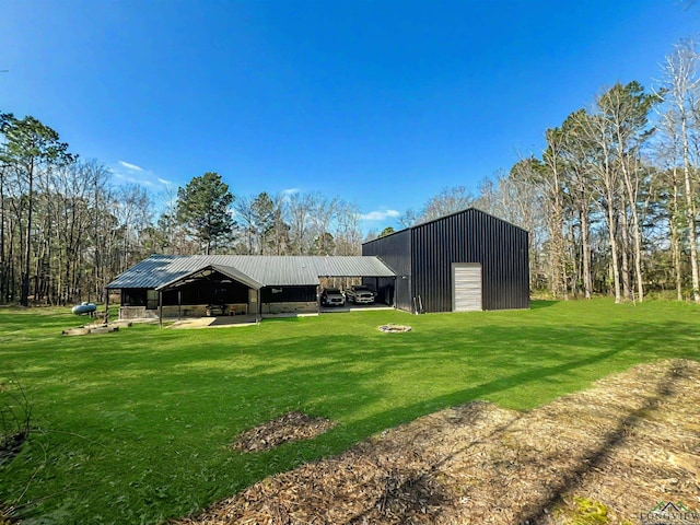 view of outbuilding featuring a garage and a yard