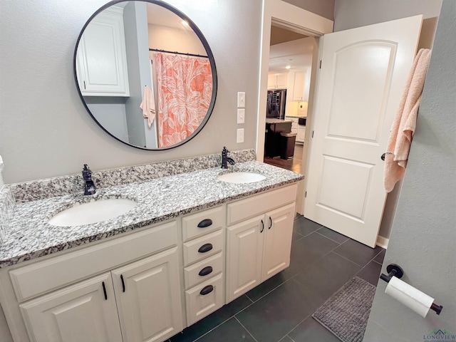 bathroom featuring tile patterned floors and vanity