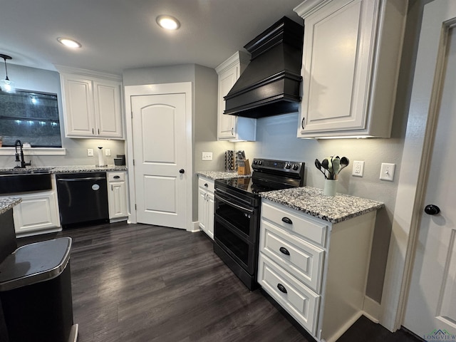 kitchen with white cabinetry, dishwasher, and range with two ovens