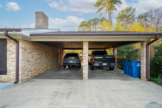 view of vehicle parking featuring a carport