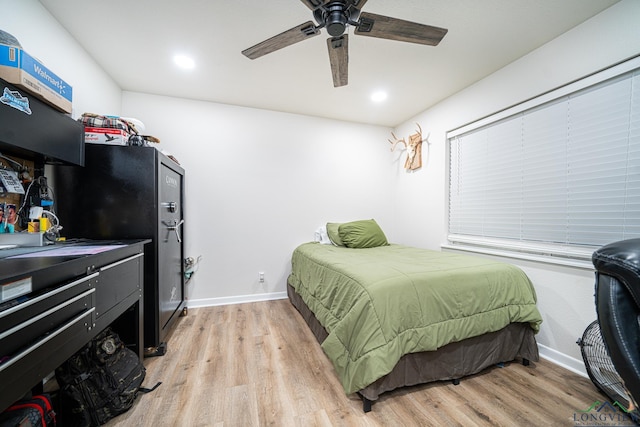 bedroom featuring ceiling fan and light hardwood / wood-style flooring