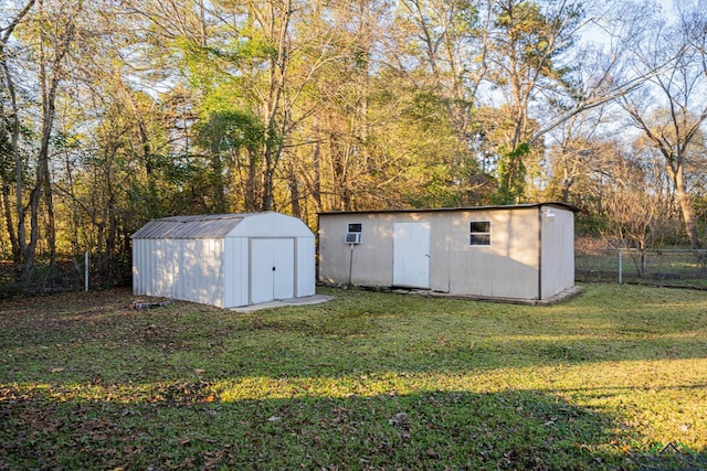 view of outbuilding featuring a lawn