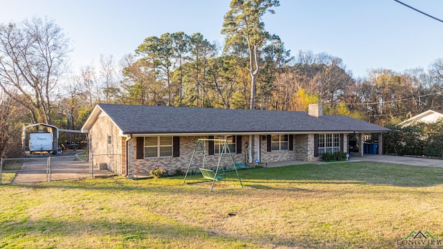 ranch-style home with a chimney, covered porch, a front lawn, a carport, and brick siding