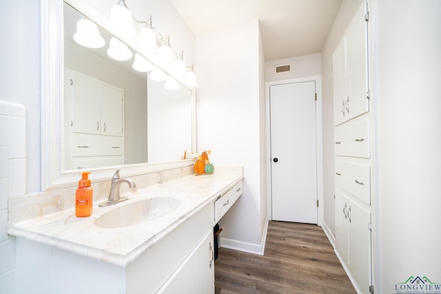 bathroom featuring vanity and wood-type flooring