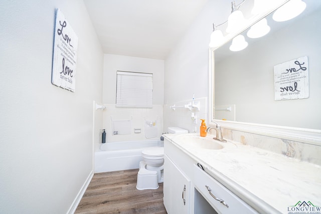 bathroom with hardwood / wood-style floors, vanity, and toilet