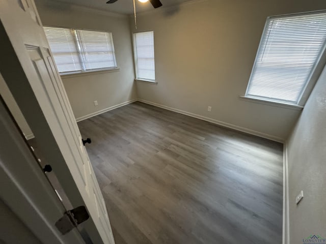 unfurnished room with hardwood / wood-style flooring, ceiling fan, and crown molding