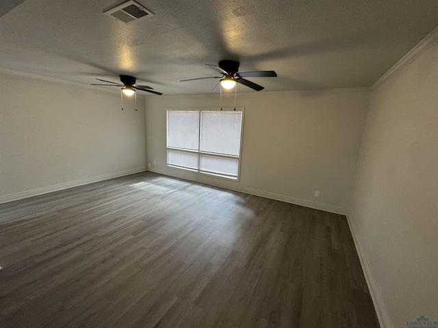 spare room with a textured ceiling, dark hardwood / wood-style floors, ceiling fan, and ornamental molding