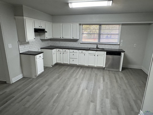 kitchen with dishwasher, sink, light hardwood / wood-style floors, decorative backsplash, and white cabinets