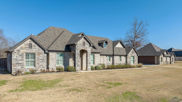 french country home with a front yard