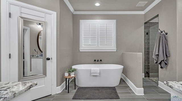 bathroom featuring ornamental molding and plus walk in shower