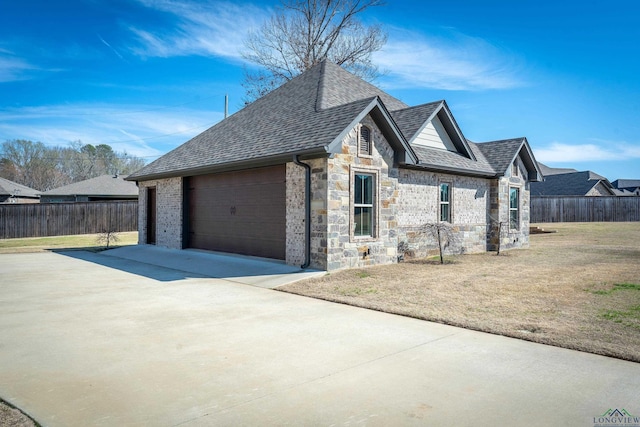 view of home's exterior with a garage and a yard