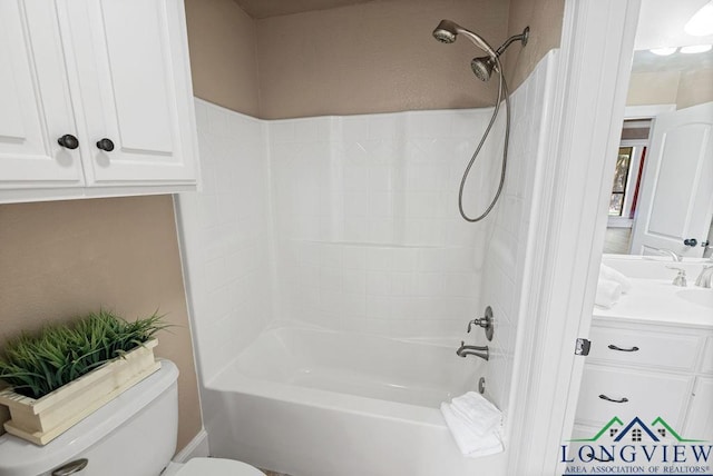 full bathroom with toilet, vanity, and washtub / shower combination