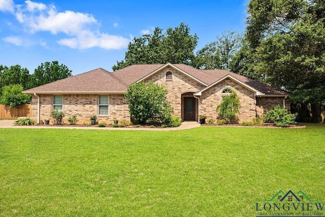 single story home with a front lawn