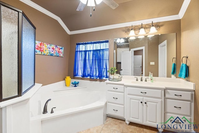 bathroom with ceiling fan, a washtub, tile patterned flooring, vaulted ceiling, and vanity