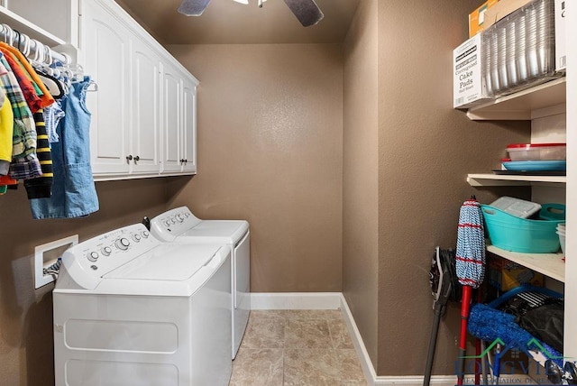 washroom featuring cabinets, ceiling fan, and washing machine and clothes dryer