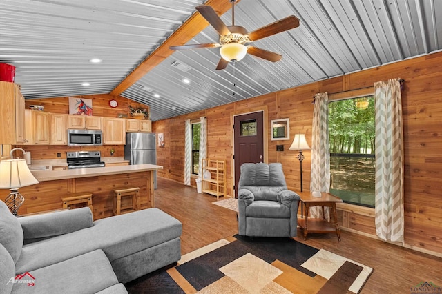 12493 S State Highway 87, Shelbyville, TX 75973 - living room featuring wood walls, dark wood-style floors, plenty of natural light, vaulted ceiling, and ceiling fan