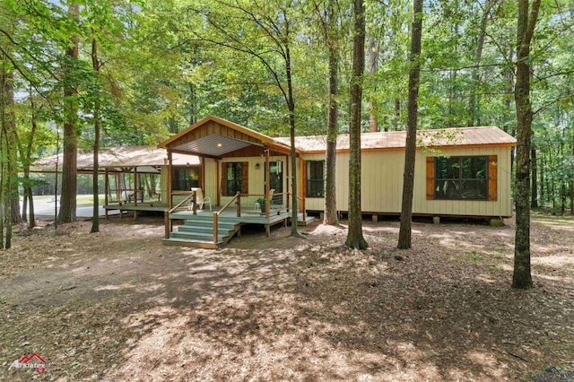 12493 S State Highway 87, Shelbyville, TX 75973 - view of front facade featuring a deck