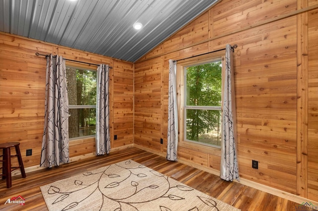 12493 S State Highway 87, Shelbyville, TX 75973 - unfurnished room featuring lofted ceiling, wood finished floors, wooden walls, recessed lighting, and baseboards
