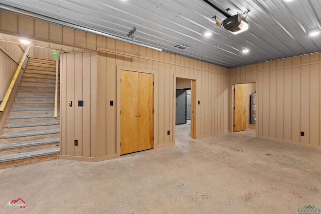 12493 S State Highway 87, Shelbyville, TX 75973 - garage featuring a garage door opener, water heater, and recessed lighting