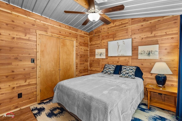 12493 S State Highway 87, Shelbyville, TX 75973 - bedroom with ceiling fan and wooden walls