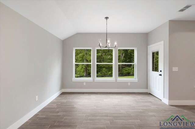 16226 Crossing Cir, Lindale, TX 75771 - unfurnished dining area with plenty of natural light, baseboards, a notable chandelier, and visible vents