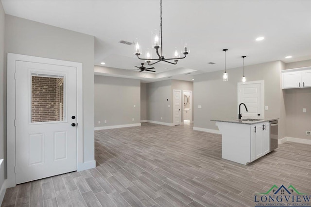 16226 Crossing Cir, Lindale, TX 75771 - kitchen with visible vents, stainless steel dishwasher, an inviting chandelier, baseboards, and a sink
