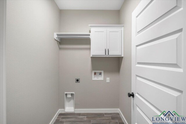16226 Crossing Cir, Lindale, TX 75771 - laundry room featuring washer hookup, wood tiled floor, electric dryer hookup, cabinet space, and baseboards