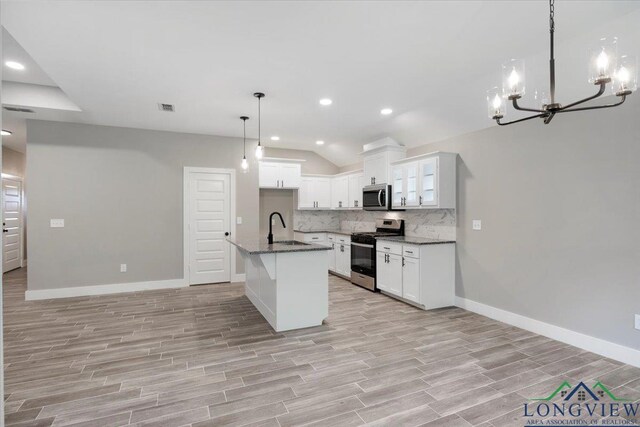 16226 Crossing Cir, Lindale, TX 75771 - kitchen featuring an inviting chandelier, decorative backsplash, recessed lighting, light wood finished floors, and appliances with stainless steel finishes