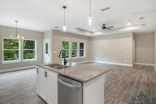 16226 Crossing Cir, Lindale, TX 75771 - kitchen with visible vents, dishwasher, a sink, baseboards, and a tray ceiling
